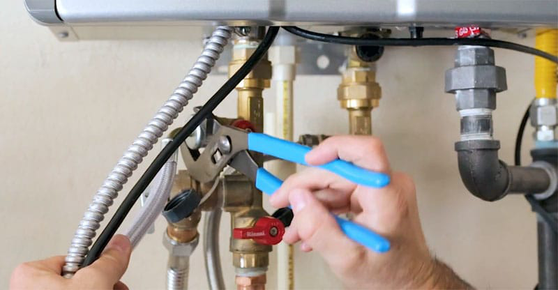 Essential maintenance services for tankless water heaters, including descaling, inspections, and cleaning by Water Heater Repair Grand Prairie TX